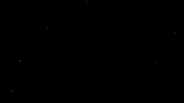 Flying Sparks Isolated on Black Background. Filmed on High Speed Cinema Camera