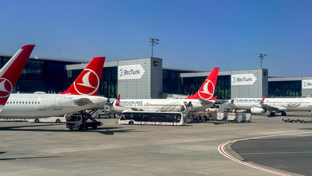 Turkish Airlines jets on Antalya apron in bright spring daylight, ideal for travel editorial, airline marketing, airport operations and logistics visuals, 5 May 2026 Antalya, Turkey