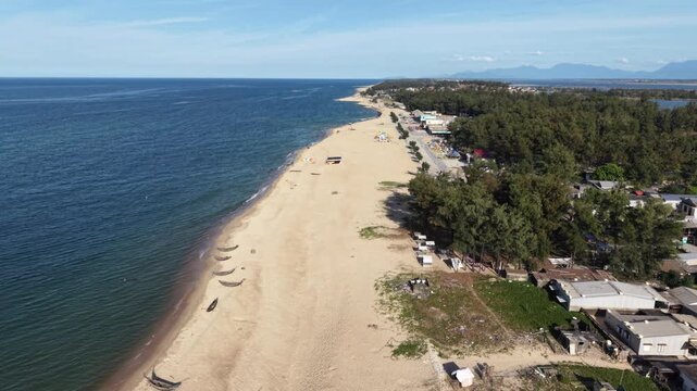 4K 60 FPS Daytime High to low Aerial forwards drone shot of Hai Duong beach, Hue, Vietnam - landscape