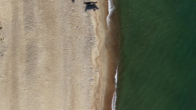 4K 60 FPS Daytime bird's eye Aerial sand on the left and sea on the right drone shot of Hai Duong beach, Hue, Vietnam - landscape
