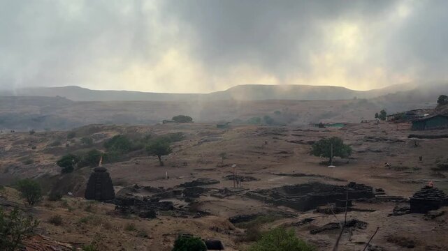 Amazing misty cloud movement during dawn at Harishchandragad Fort.