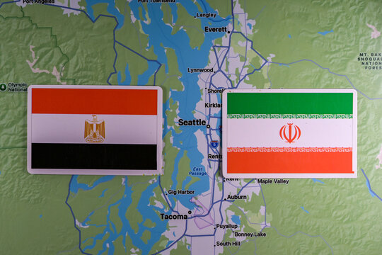 June 9, 2026, United States. Flags of the participants of the FIFA World Cup group stage of the national teams of Egypt and Iran on the background of the Seattle map.