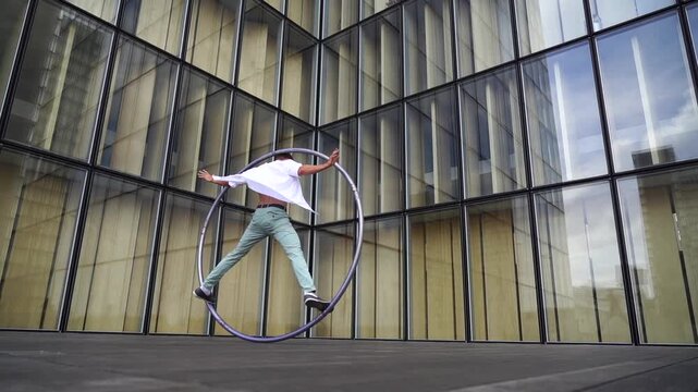 Dynamic Performance Featuring Hula Hoop in an Urban City Setting with Vibrant Energy