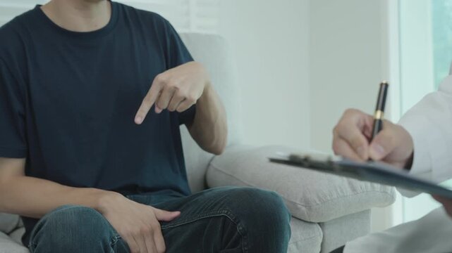 Man hold hand in front of private parts feeling discomfort and consult doctor. Venereal, testicular cancer. bladder problems, erectile dysfunction, premature ejaculation, prostate cancer