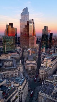 Panoramic aerial view of the City of London, England, skyline with Bank and Cornhill during golden sunset time