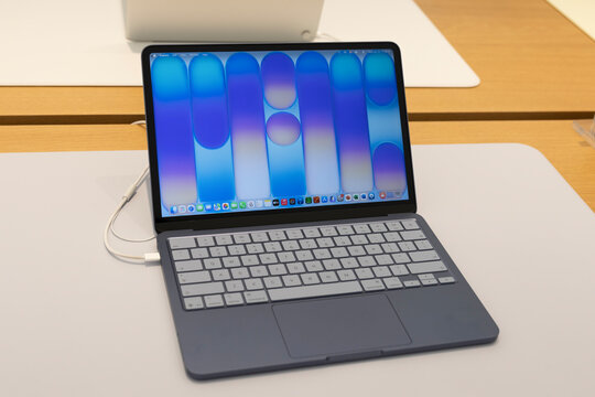 MacBook Neo display at an Apple Store. MacBook Neo is a budget Mac inexpensive laptop that runs on an iPhone processor.