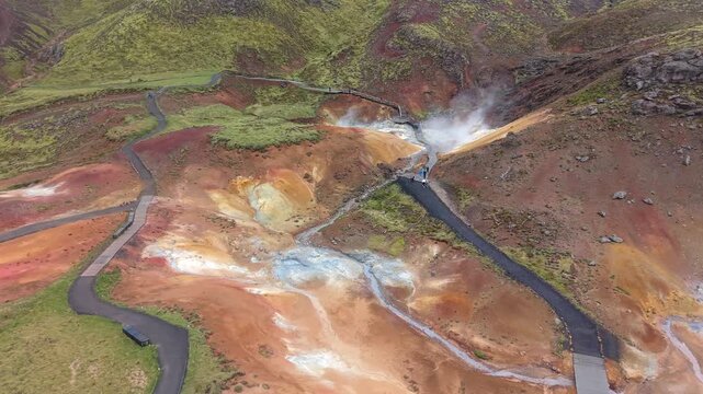 Aerial view of the Seltun geothermal area in Krysuvik, Iceland. Colorful mineral deposits, steaming fumaroles, and hiking trails