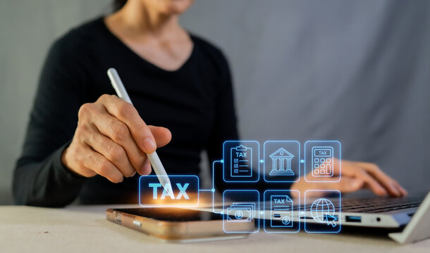 Woman using smartphone and laptop for online tax payment calculation and e-filing return concept