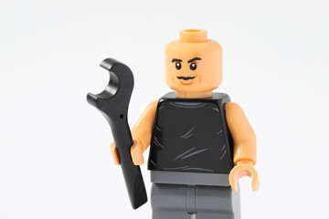 Naklejka premium Lego minifigure of car mechanic with wrench tool