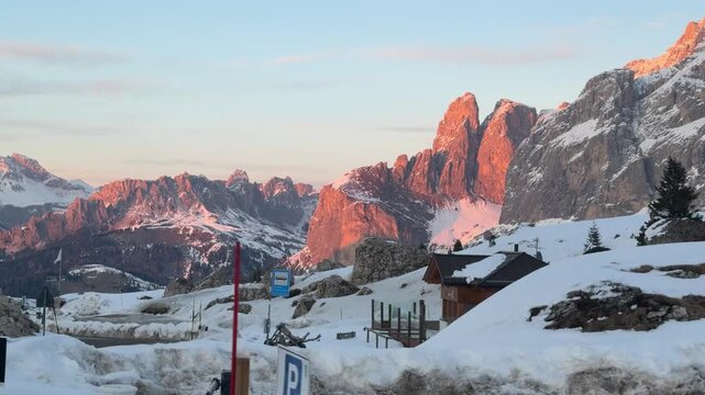 Driving through Selva di Val Gardena at sunset. The famous Dolomite peaks glow in Enrosadira colors, turning every mountain road into an unforgettable alpine journey