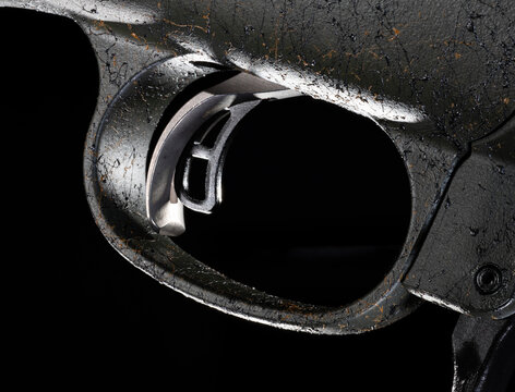 Rifle trigger with two paddles on a black background