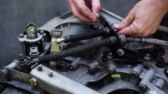 old gear shift box from a front-wheel drive car installing cables and shifting gears disassembly for repair