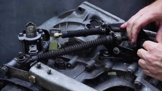 old gear shift box from a front-wheel drive car installing cables and shifting gears disassembly for repair