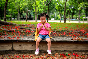 Child superhero in vibrant park. © Rawpixel.com