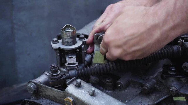 old gear shift box from a front-wheel drive car installing cables and shifting gears disassembly for repair