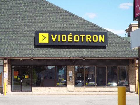 Gatineau, Quebec, Canada &ndash; May 10, 2026: The storefront for a "Videotron" retail location is situated in a commercial plaza with a green shingled roof  at 355 Bd Gr&eacute;ber.