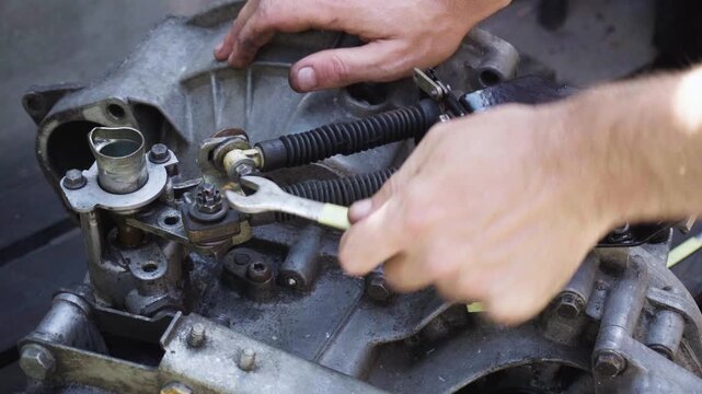 old gear shift box from a front-wheel drive car installing cables and shifting gears disassembly for repair