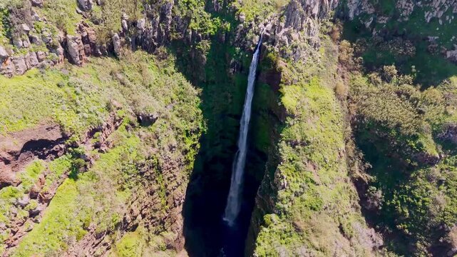 Aerial view of Garganta Funda waterfall in Ponta do Pargo, one of the highest waterfalls in Madeira, Portugal