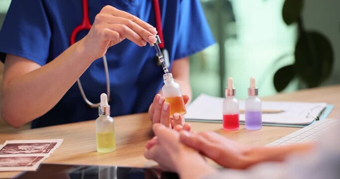 Female dermatologist demonstrates serum glass bottle to patient in office. Doctor shows cosmetic product for skincare to woman in clinic slow motion