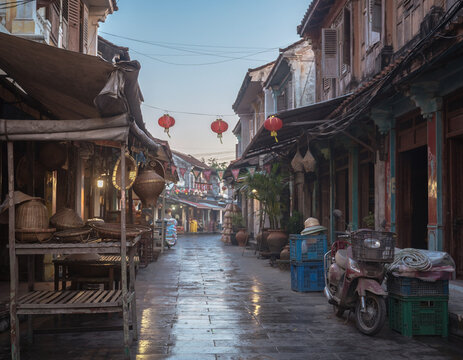 After the rain, an empty lantern street waits like a forgotten line of dialogue