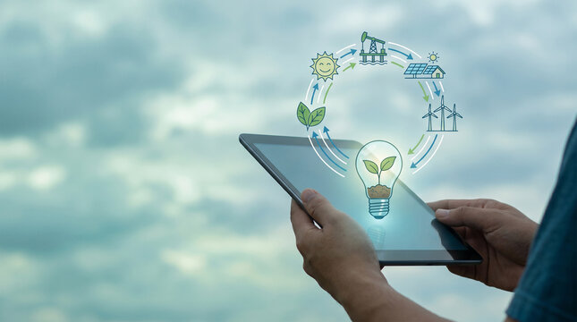 Digital tablet displaying renewable energy transition icons and sustainable growth concepts for green technology development against a cloudy sky