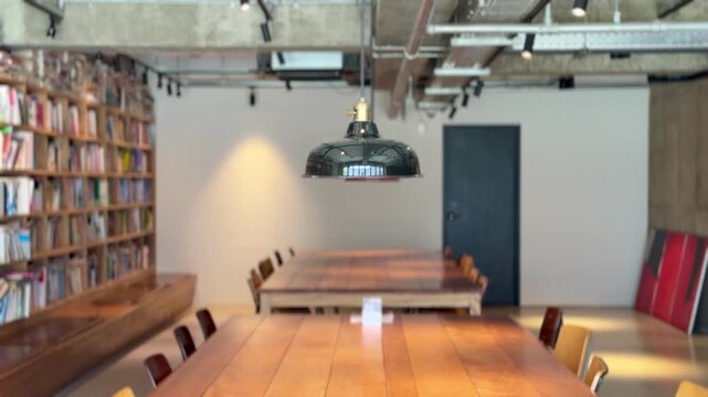 Empty Study Area with Bookshelves and Long Wooden Tables