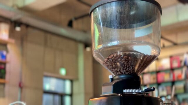 Coffee Grinder with Fresh Roast Beans in a Cafe Setting