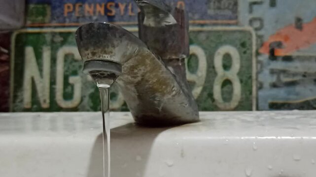 An aging water faucet with visible rust and corrosion, illustrating long-term exposure to moisture, weathering, and everyday use.