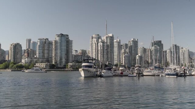 Water Bikes On Fraser River With Vancouver Skyline Background