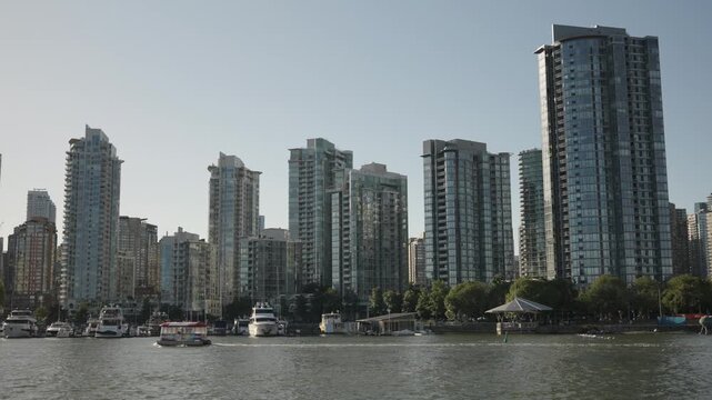 Water Bikes On Fraser River With Vancouver Skyline Background Video