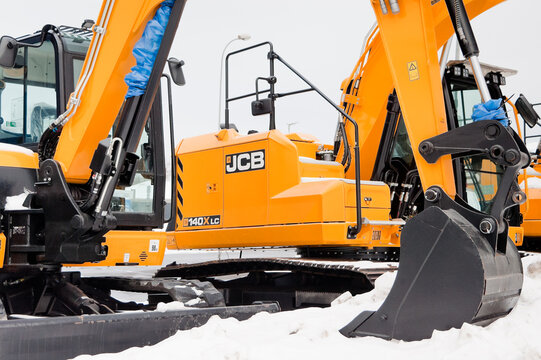 Riga, Latvia - February 7, 2026: New JCB excavators on the street near the auto center in winter