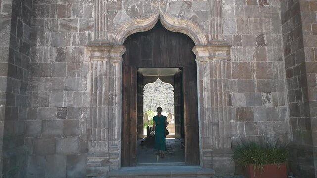 Enjoy the moments of a happy senior woman discovering the beauty of Loreto Mission church in San Javier, Baja California Sur, Mexico