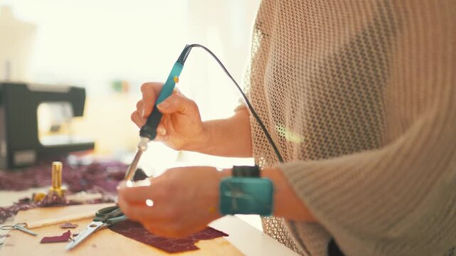 Fashion designer works on creative project at the studio in the late afternoon