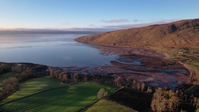Flying over Applecross Bay at sunset, a scenic, beautiful coastal area in Torridon, Scotland