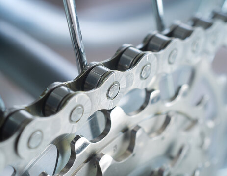 Chrome links whisper like a metallic river in shallow focus