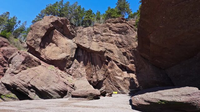 Watch as the Flowerpot Rocks emerge at low tide in Hopewell Cape, New Brunswick. The sun rises over the famous rock formations in Bay of Fundy