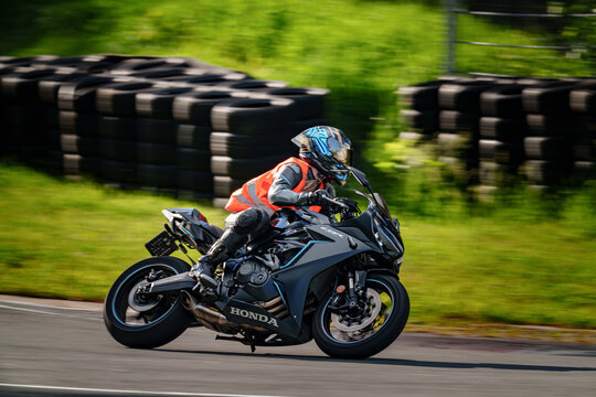 Regular training in Riga, Latvia, Bikernieki on 12-05-2026  Motorcyclist leaning into a curve on a race track with tire wall background