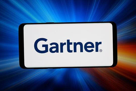 Stuttgart, Germany - 06-08-2026: In this photo illustration, the logo of US research and advisory company Gartner Inc. is displayed on a smartphone in front of abstract background on computer screen.