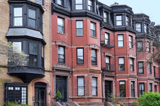 row of old townhouses with bay windows