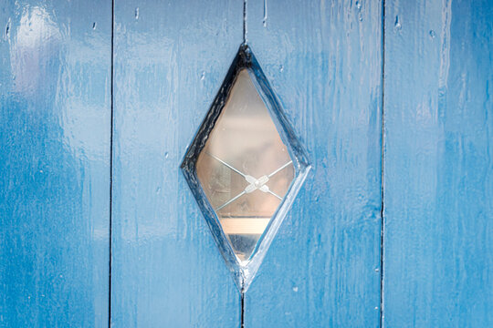 Pale blue wood gleams under soft, diffused light.