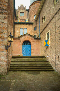 Cobblestone gleams under overcast skies, ancient bricks whisper tales.