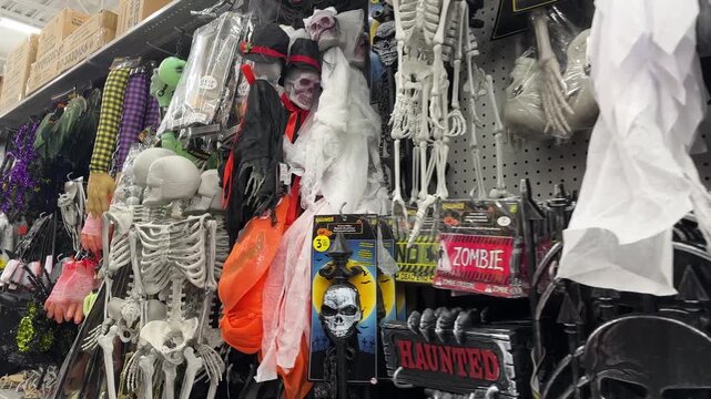 This clip showcases a wide range of Halloween products in a store located in Halifax, Nova Scotia. Various items include decorations and costumes for the holiday