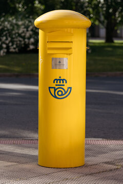 Logrono, La Rioja, Spain - may 31 2026: Bright Yellow Postal Mailbox Correos on City Sidewalk.