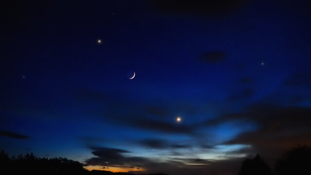 Crescent Moon, planet conjunction and landscape scenery silhouettes.
