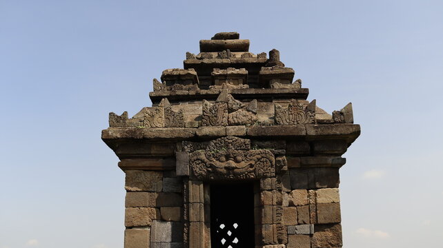 Close-up architectural details of ancient stone temple roof structures in Prambanan, Indonesia