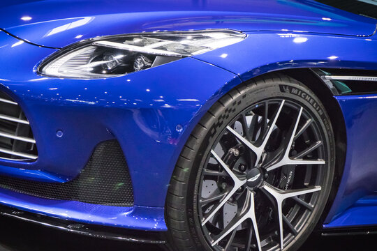 Poznan, Poland - April 05, 2024: Poznan Motor Show. Front of sports blue Aston Martin DB12. Detail of vehicle