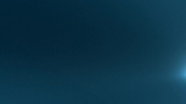 Blue glowing geometric panel with light particles on dark background