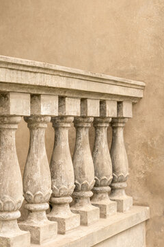 Weathered stone balustrade detail on historic facade