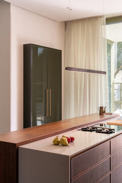 Kitchen island with cooktop and soft daylight