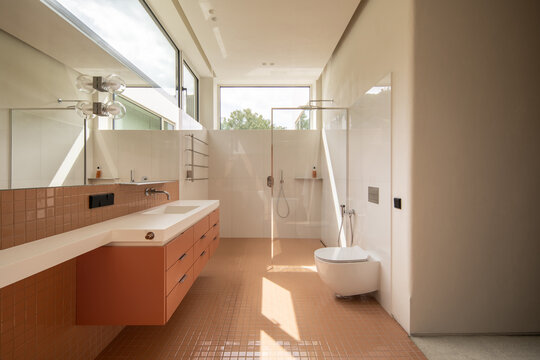 Bathroom sink with orange tiles